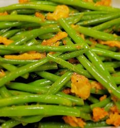 green beans with crispy toppings in a white bowl