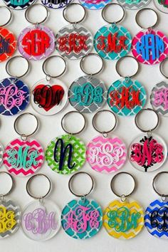 many different colored key chains with monogrammed letters