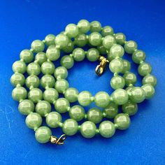 * Vintage Gold Tone Hand Knotted Green Jade Jadeite Large Bead Necklace * Metal: Mixed * Necklace Length: 24.0" * Necklace Width: 3/8" * Sixty-Six (66) Jade Beads Measure: Approximately 8 Mm Each * Necklace Weight: 47.6 Tgw * Marked: Unbranded * Condition: Great. * C150 Classic Green Beaded Necklaces With Round Beads, Large Bead Necklace, Jade Beads, Green Jade, Metal Necklaces, Jade Green, Jewelry Vintage, Necklace Length, Bead Necklace