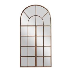 an arched window with glass and metal frame