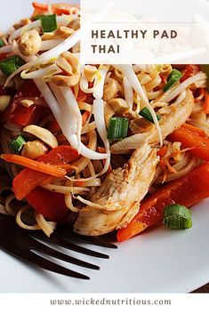 a white plate topped with noodles and vegetables