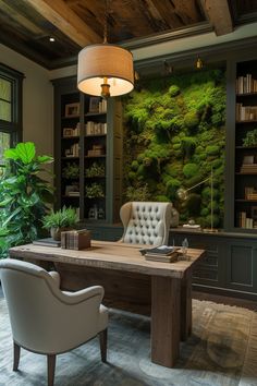 an office with a desk and chairs in front of a moss covered wall