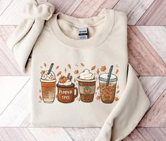 Trendy Fall Coffee Latte Graphic Sweatshirt, Cute Hello Fall Shirt, Womens Fall Vibes Apparel, Unisex Pumpkin Season Sweater, Autumn Leaves Fashion, Fall Teacher Outfit, Preppy Thanksgiving Gifts, Plus Size Spooky Season Halloween Clothing, Christmas Sweatshirt, Iced Coffee Lover Gifts, Pumpkin Spice Shirt This well-loved, cozy pumpkin season sweatshirt is perfect for your favorite fall, autumn, Halloween, or Christmas nights! ✧ SIZING ✧ ⋒ Please check our size chart before placing an order. ⋒ I Fall Crewneck Sweatshirt, Cute Sweaters For Fall, Teacher Outfits Fall, Thanksgiving Sweater, Pumpkin Spice Shirt, Coffee Sweatshirt, Plus Size Halloween, Football Sweatshirt, Fall Coffee