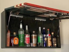 an assortment of liquor bottles on a shelf