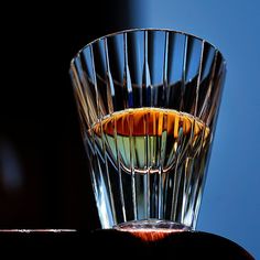 an empty glass sitting on top of a table