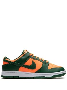 Shop Nike Dunk Low "Miami Hurricanes" sneakers Nike Tenis, Nike Low Tops, Nike Models, Nike T, Green Sneakers, Swoosh Logo, November 1, Nike Dunk Low, Sportswear Brand