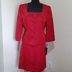 Unique Square-Neck, Pleated Collar And Covered Buttons Highlight This Amazing Suit By Tahari. Fully Lined. Official Color On Tag Is "Ruby Zen" - Deep Red. Built In Light Shoulder Padding. Straight Waist On The Skirt With Zipper In Back. Three Pleats Down The Back Of Skirt. 3/4 Length Sleeves. Packet With Extra Button Attached With Tags. N3144 Approx Measurements Laying Flat: Jacket: Underarm To Underarm: 20" Sleeve From Shoulder To Hem: 20" Across Shoulders: 17" Length From Shoulder To Hem: 21" Check Print Skirt, Tweed Skirt Suit, Light Blue Skirts, Pleated Collar, Blazer And Skirt Set, Gold Skirt, Skirt With Zipper, Red Suit, Stretch Skirt