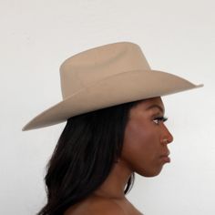 The Upland Western Cowboy Hat seamlessly blends the rustic charm of the Wild West with a dash of futuristic boho flair. With its distinctive cowboy silhouette, complete with a cattleman creased crown and a stylish upturned brim, this hat exudes classic Texan allure. The leather band is adorned with gleaming silver jewels, adding a contemporary twist to this timeless fashion statement. Handcrafted and meticulously embroidered with the initials "BTR," this hat exemplifies the perfect fusion of tra Western Brown Boater Hat With Flat Crown, Western Brown Boater Hat With Curved Brim, Western Style Brown Wide Brim Boater Hat, Brown Western Boater Hat With Wide Brim, Brown Wide Brim Western Boater Hat, Fitted Felt Hat With Curved Brim For Rodeo, Classic Fedora For Festivals, Classic Fedora Hat For Festivals, Western Style Solid Fedora For Spring