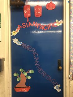 the door to an american heritage classroom is decorated with stickers and paper cutouts