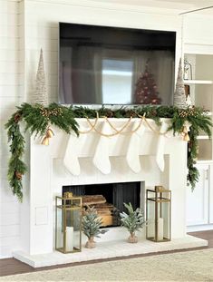 a fireplace decorated for christmas with stockings and pine cones