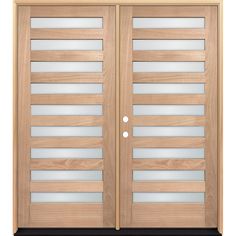 a pair of wooden doors with glass inserts on the top and bottom paneling