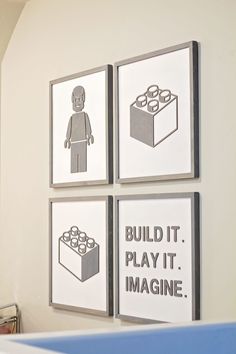 three legos are displayed on the wall above a crib in a child's bedroom