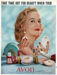 an advertisement for cosmetics with a woman looking at it