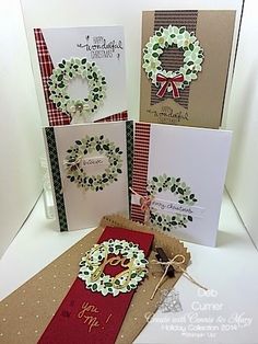 three cards with christmas wreaths on them, one is folded and the other two are closed