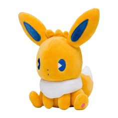 a yellow stuffed animal with blue eyes and ears