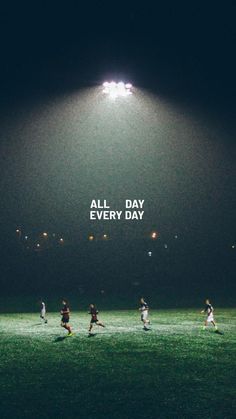 a group of people playing soccer on a field with the words all day every day