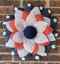 an american flag flower on a brick wall