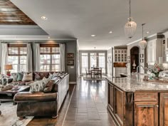 a large kitchen and living room in a house