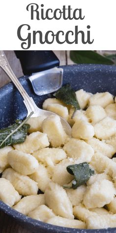 a pan filled with ravioli on top of a wooden table