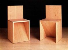 two wooden cubes sitting on top of a hard wood floor next to each other