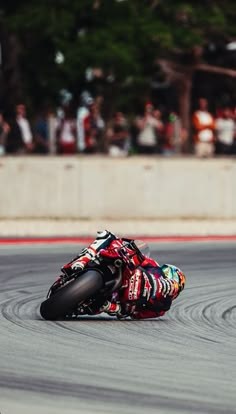 a person riding a motorcycle on a race track