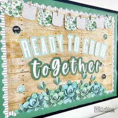 a wooden sign that says ready to grow together with succulents on it