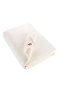 a white blanket folded on top of each other