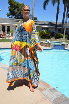 Absolutely stunning designer print, silk caftan, with it's breathtaking art print, would be a very special addition to your wardrobe. This luxurious, silk caftan is the height of glamour for beach, pool, that special vacation or just looking fantastic lounging or entertaining. One size. Fits many sizes, small to X-large. The width, edge to edge, is 54 inches or 108 inches around the body. The length is 52 inches. The side seams are 7 inches from the edge and can be adjusted if needed. The neckli White Mesh Dress, Silk Caftan, Office Dresses For Women, Silk Kaftan, Silk Dress Long, Bohemian Maxi Dress, Beach Maxi Dress, Dress Silk, African Dresses For Women