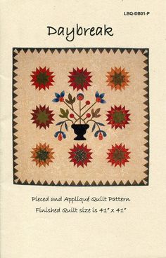 the back cover of a quilt book with an image of flowers in a vase on it