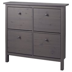 a gray dresser with four drawers and two doors on each side, in front of a white background