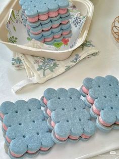 blue and pink cookies are on a table