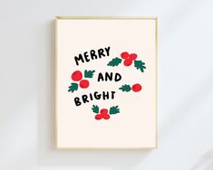 a merry and bright christmas card with holly leaves on it, hanging on a wall