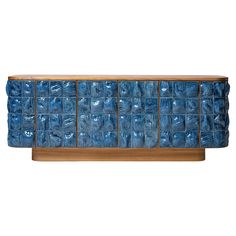 a blue cabinet with lots of glass blocks on it's front and back sides