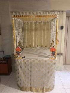 the bed is decorated with gold and white decorations