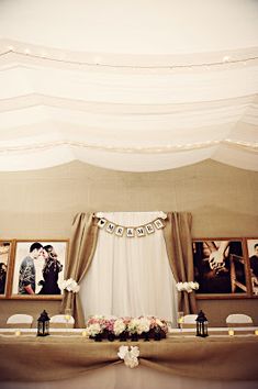 an image of a wedding setup with pictures on the wall