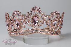 a pink tiara with crystal stones on it