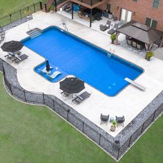 an aerial view of a pool and patio area