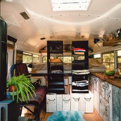 the interior of an old camper van with lots of storage space and plants in it