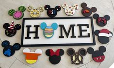 mickey mouse magnets are arranged around the home sign