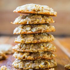 a stack of oatmeal cookies sitting on top of a wooden table