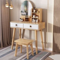 a wooden dressing table with stool and mirror