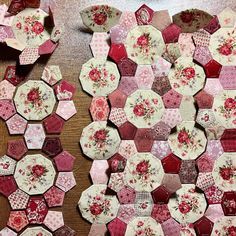 several pieces of fabric are laid out on the table to look like hexagons