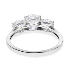 a white gold ring with three stones on the top and two diamonds on the bottom