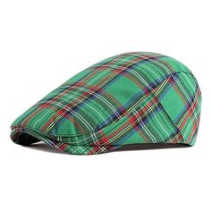 a green and red plaid hat on a white background