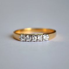 "A beautiful 5 diamond ring, set in solid 14K yellow gold, this makes for a simple yet perfect wedding band or anniversary rings. * Total carat weight : 0.25 Cts * Color-Clarity Grade : H-I, Vs-Si * Gold : 14K, 2.84 gms yellow gold (Approx) * Band Width - 2.5 mm If you like this ring, please press \"Pin it\" button on the top of your screen. Follow us on Instagram : @abhikajewels Like us on Facebook: www.facebook.com/Abhikajewels Thank you for visiting our shop.. :)" 5 Stone Wedding Band, 5 Diamond Ring, Journey Band, Wedding Band Diamond, Anniversary Rings For Her, Stone Wedding, Diamond Crown, Sapphire Wedding, Diamond Rings Bands