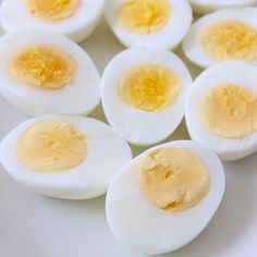 several hard boiled eggs on a white plate