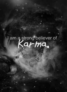 a black and white photo with the words i am a strong believer of karma