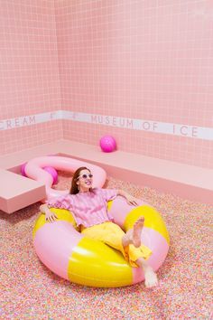 a woman sitting on an inflatable pool chair