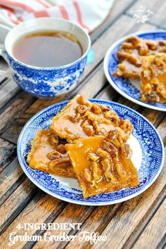 two blue and white plates with pieces of pecan brittle on them next to a cup of tea