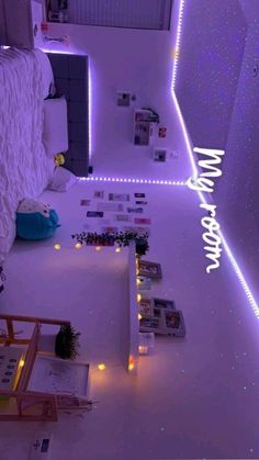 the room is decorated with purple lights and white carpeted flooring, along with bookshelves